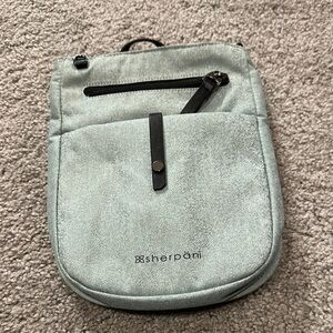 Sherpani Gray Travel Bag with Durable Fabric and Unique Design